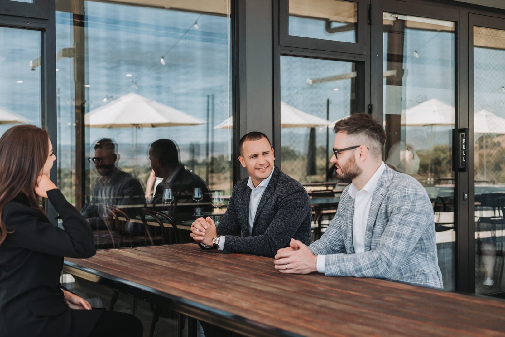 TNL IT team meeting at a terrace table